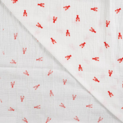 Detailaufnahme von Musselin Off White mit kleinen Hummern